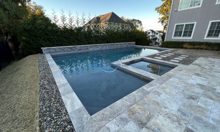inground pool with spa and retaining wall installation, custom swimming pool