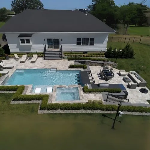 rectangular style inground pool with light blue turquoise water, luxury pools
