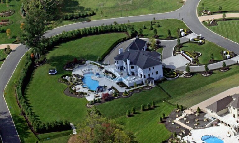 inground pool installation on backyard of big mansion, pool companies in nj