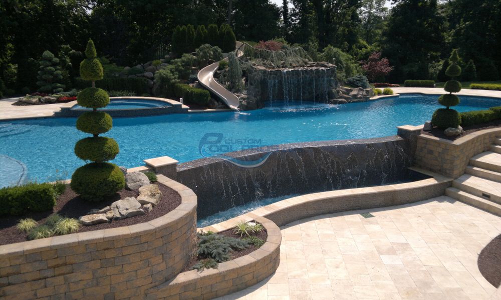 luxury custom gunite pool with spa, grotto, waterfall, slide, pool patio, vanishing edge Williamstown NJ, pool contractor