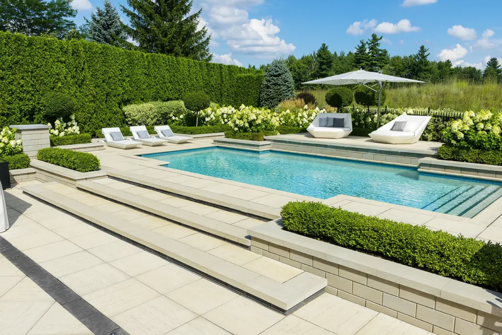 Pool trends, modern pool design, and luxury pools shown in backyard pool image.